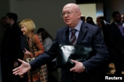 FILE - Russian Ambassador to the United Nations Vassily Nebenzia speaks to reporters outside Security Council chambers at the U.N. headquarters in New York, April 12, 2018.