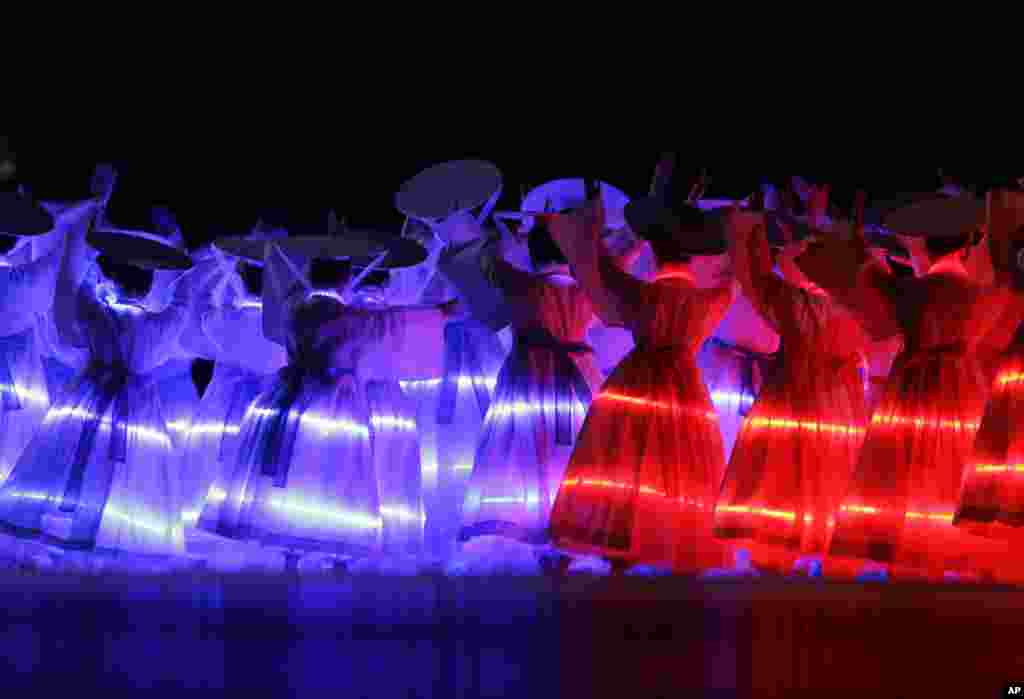 Artists perform during the opening ceremony for the 17th Asian Games in Incheon, South Korea. 
