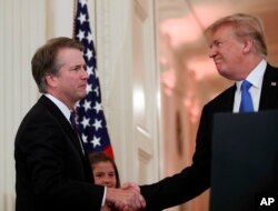 President Donald Trump shakes hands with Judge Brett Kavanaugh his Supreme Court nominee, in the East Room of the White House, July 9, 2018, in Washington.