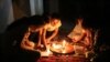 The government has cut power and water to Sur, in Diyarbakir, Turkey, as efforts are made to rebuild it. A family reads by the light of candles inside their home.