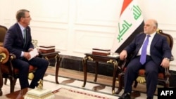 FILE - A handout picture by the Iraq Prime Minister's Press Office shows Iraqi Prime Minister Haider al-Abadi, right, meeting with U.S. Secretary of Defense Ash Carter in Baghdad, Oct. 22, 2016. Abadi insists Mosul can be taken by year’s end.