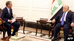 A handout picture released by the Iraq prime minister's press office shows Iraqi Prime Minister Haidar al-Abadi, right, meeting with U.S. Secretary of Defense Ash Carter in Baghdad, Oct. 22, 2016.