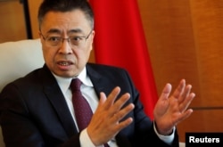 FILE - Zhang Xiangchen, Chinese ambassador to the World Trade Organization (WTO) attends an interview with Reuters in Geneva, Switzerland, March 22, 2018.