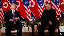 President Donald Trump listens as North Korean leader Kim Jong Un speaks during a meeting, Feb. 27, 2019, in Hanoi. 