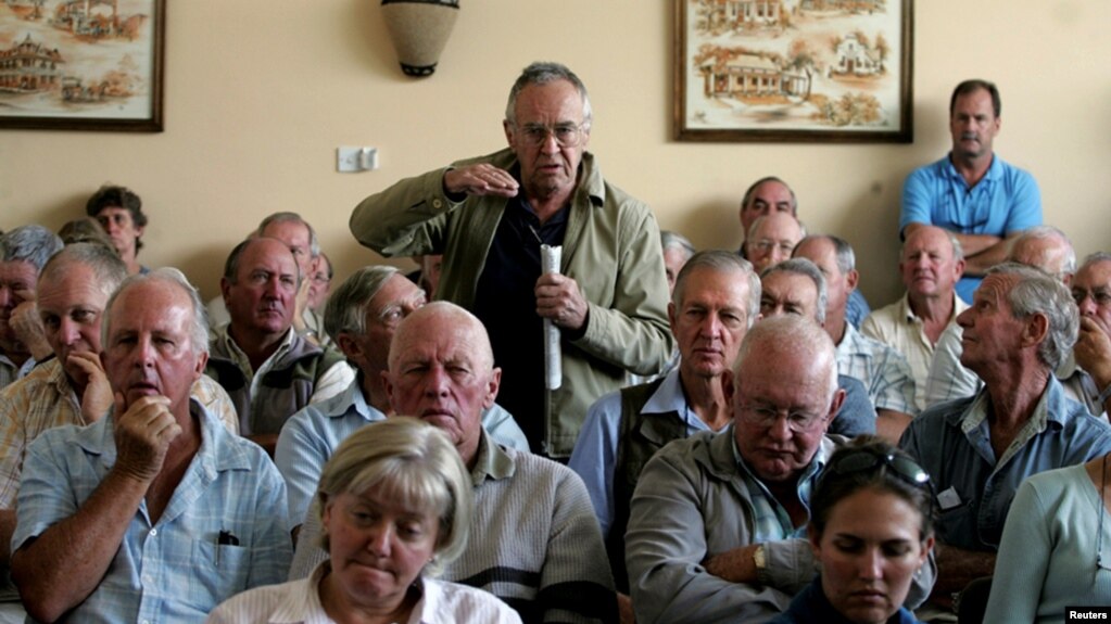 FILE - A farmer addresses a meeting of white commercial farmers in Harare, Zimbabwe, Feb. 5, 2010.