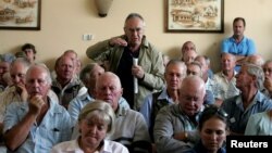 FILE - A farmer addresses a meeting of white commercial farmers in Harare, Zimbabwe, Feb. 5, 2010.