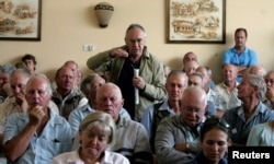 FILE - A farmer addresses a meeting of white commercial farmers in Harare, Zimbabwe, Feb. 5, 2010.