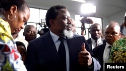 Democratic Republic of Congo President Joseph Kabila displays ink on his hand after casting his vote at a polling station in Kinshasa, Dec. 30, 2018. 