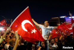 Supporters of Turkish President Tayyip Erdogan gather at Taksim Square in central Istanbul, July 16, 2016.