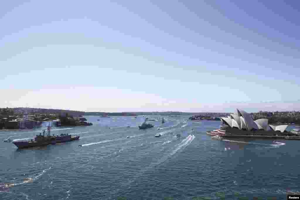 Royal Australian Navy warships led by HMAS Sydney enter Sydney Harbor as part of the International Fleet Review celebrations, Oct. 4, 2013. 