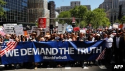 Demonstrators march as they take part in an anti-Trump "March for Truth" rally on June 3, 2017 in New York City.