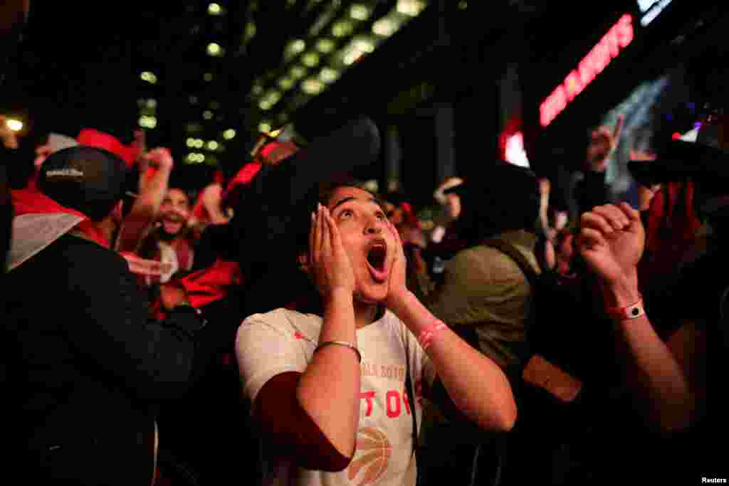 Fans are in shock as they celebrate the Toronto Raptors win over the Golden State Warriors in Oakland, California in Game Six of the best-of-seven NBA Finals, Toronto, Ontario, Canada.