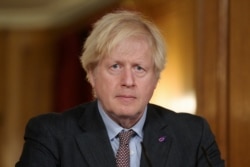 Britain's Prime Minister Boris Johnson leads a virtual news conference on the COVID-19 pandemic inside 10 Downing Street in London, Britain January 27, 2021.