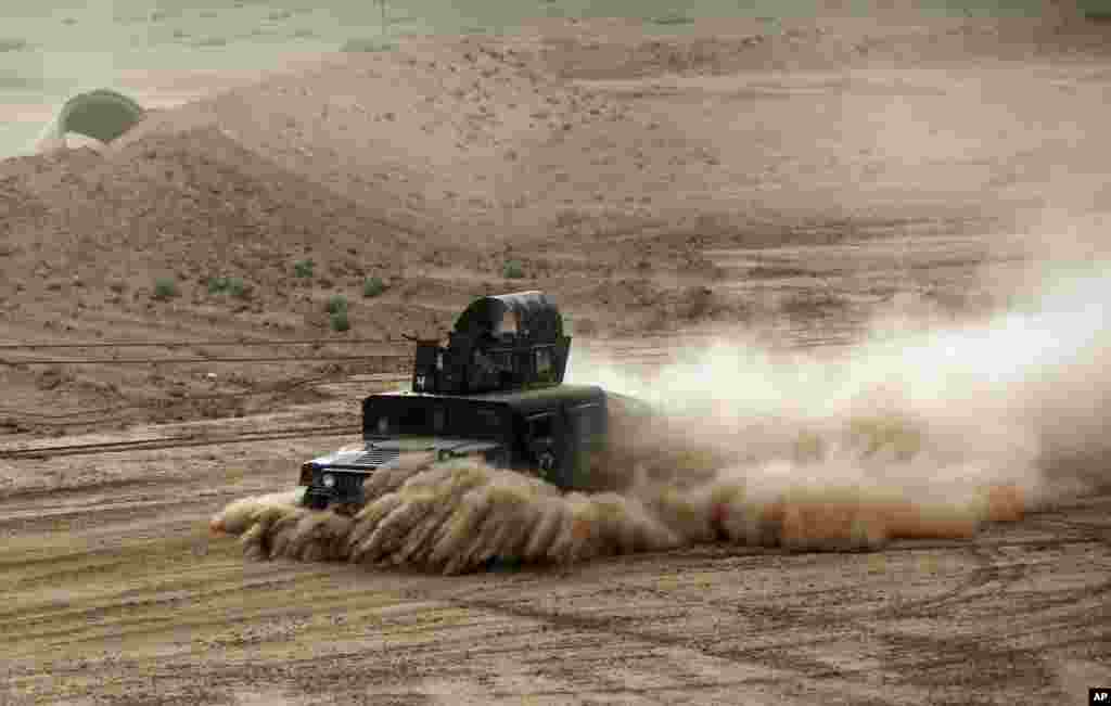 An Iraqi Army armored vehicle prepares to attack Islamic State extremists in Tikrit, 80 miles (130 kilometers) north of Baghdad.