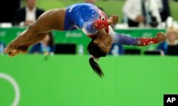 American Simone Biles performs on the floor during the artistic gymnastics women's apparatus final at the 2016 Summer Olympics in Rio de Janeiro, Brazil, Tuesday, Aug. 16, 2016. (AP Photo/Dmitri Lovetsky)