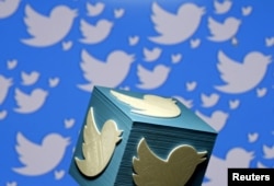 FILE - A 3-D-printed logo for Twitter is seen in this illustration, Jan. 26, 2016.