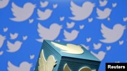 FILE - A 3-D-printed logo for Twitter is seen in this illustration, Jan. 26, 2016.