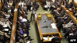 FILE - Prime Minister Morgan Tsvangirai (R) delivers his first speech as Prime Minister at the Zimbabwean parliament in Harare, March 4, 2009.