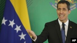 Venezuela's self-proclaimed interim president Juan Guaido speaks during a joint statement with Brazils President Jair Bolsonaro, in Brasilia, Brazil, Feb.28, 2019. 