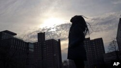 A survivor of sexual assault meditates in the Brooklyn borough of New York on March 14, 2019.