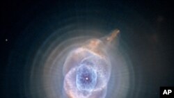 This image of the Cat's Eye Nebula, captured by the Hubble telescope, is one of the first planetary nebulae discovered and has one of the most complex forms known to this kind of nebula. Eleven rings, or shells, of gas make up the Cat's Eye.