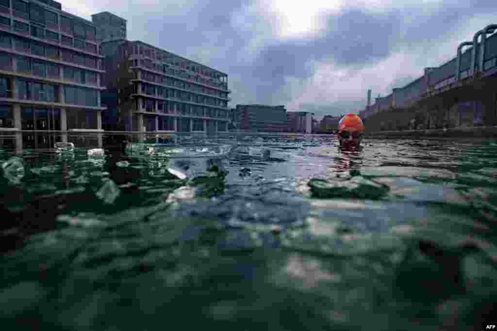 An ice-swimmer swims in the partly frozen Ourcq canal in Pantin near Paris, France, Jan. 29, 2017.