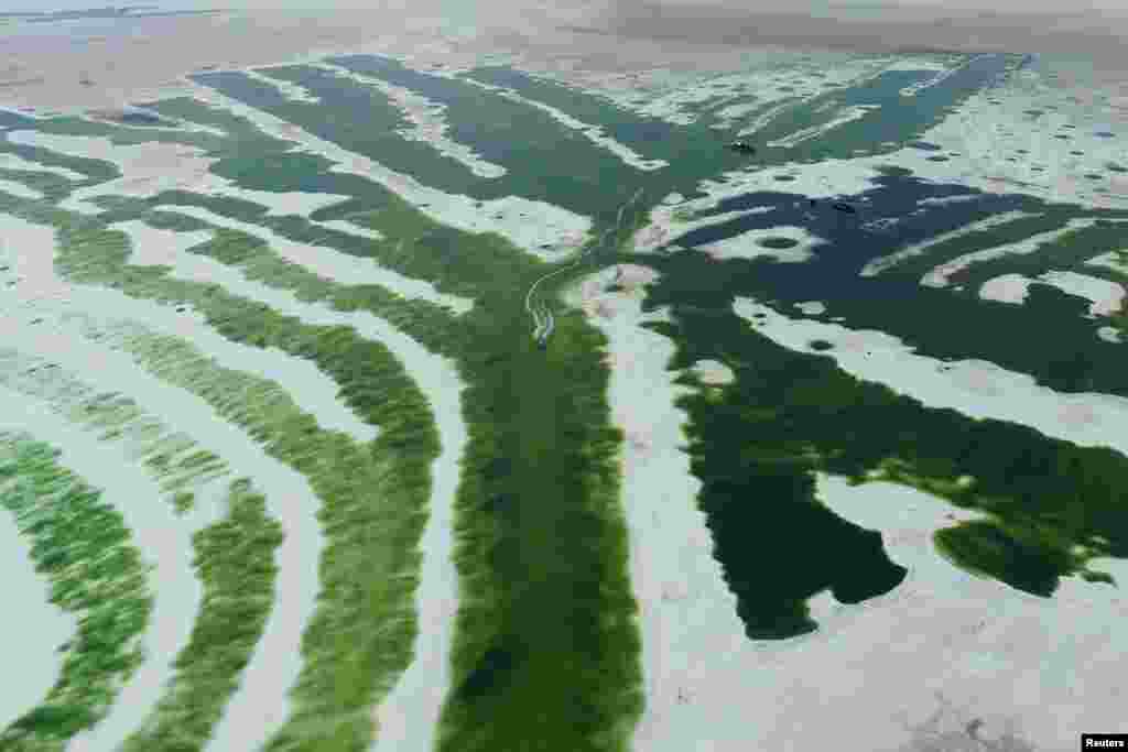 An aerial view showing boats at Chaka Salt Lake in Haixi, Qinghai Province, China.