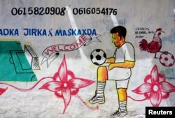 A mural depicting a soccer player is seen on a wall of a stadium in Hodan district of Mogadishu, Somalia, June 13, 2017.