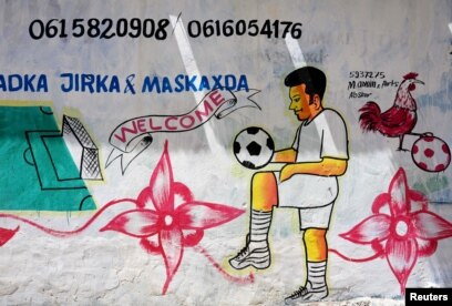 A mural depicting a soccer player is seen on a wall of a stadium in Hodan district of Mogadishu, Somalia, June 13, 2017.