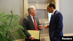 U.S. National Security Adviser John Bolton and his Turkish counterpart Ibrahim Kalin (R) meet at the Presidential Palace in Ankara, Turkey, Jan. 8, 2019.