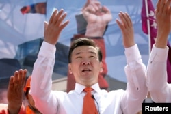 Sainkhuu Ganbaatar of the Mongolian People's Revolutionary Party (MPRP) waves to supporters as he begins campaigns in the Mongolian presidential elections in Ulaanbaatar, Mongolia, June 6, 2017.