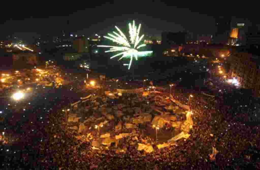 Egyptians set off fireworks as they celebrate after President Hosni Mubarak resigned and handed power to the military at Tahrir Square, in Cairo, Egypt, Friday, Feb. 11, 2011. Egypt exploded with joy, tears, and relief after pro-democracy protesters broug