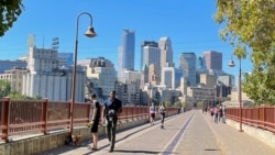 Minnesota state Rep. Esther Agbaje’s district includes downtown Minneapolis, shown from the Stone Arch Bridge that spans the Mississippi River. (Carol Guensburg/VOA)