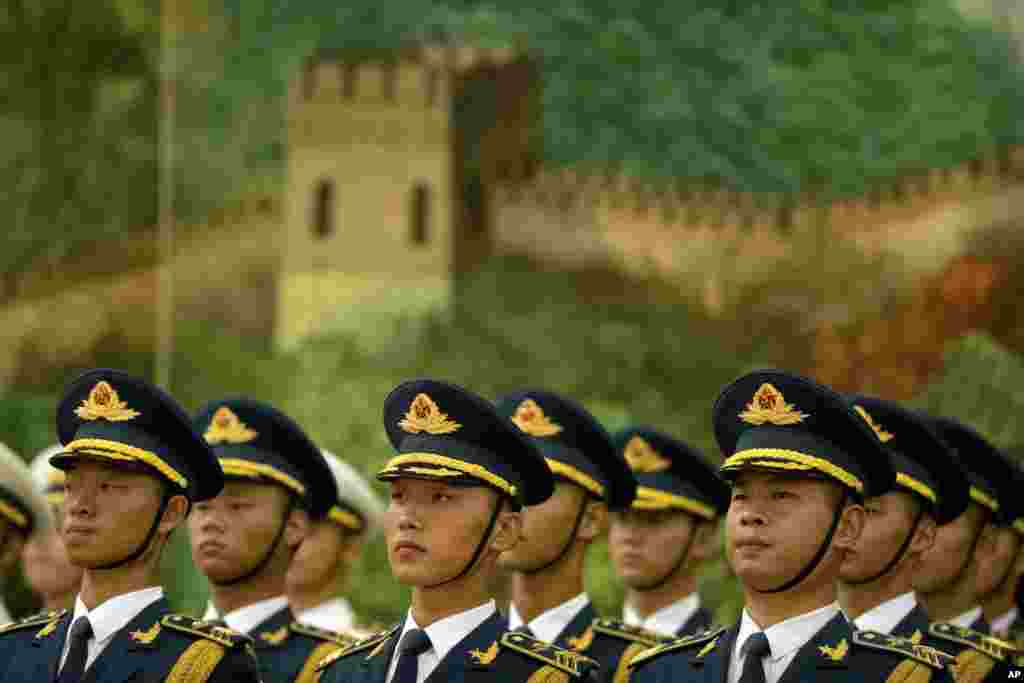 Members of a Chinese honor guard stand at attention during a welcome ceremony for Myanmar's State Counselor Aung San Suu Kyi at the Great Hall of the People in Beijing.