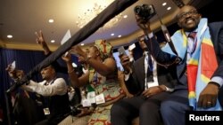 FILE: Attendees cheer as U.S. President Barack Obama (not pictured) arrives onstage at the Young African Leaders Initiative (YALI) Mandela Washington Fellowship Presidential Summit in Washington, August 3, 2015.