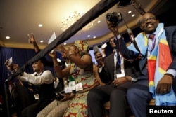 FILE: Attendees cheer as U.S. President Barack Obama (not pictured) arrives onstage at the Young African Leaders Initiative (YALI) Mandela Washington Fellowship Presidential Summit in Washington, August 3, 2015.