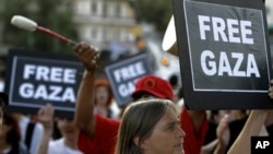 Activists of Gaza flotilla gathering outside the Ministry of Public Order in Athens, Greece, Sunday, July 3, 2011.