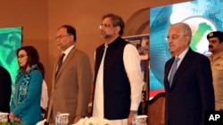 In this photo released by Press Information Department, Pakistani Prime Minister Shahid Khaqan Abbasi, center, attends the International Counter Terrorism Forum in Islamabad, Pakistan, April 5, 2018.