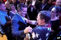 Sen. Ted Cruz, R-Texas, left, greets the crowd during a campaign event Monday, Nov. 5, 2018, in Cypress, Texas. (AP Photo/David J. Phillip)