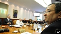 Israeli Prime Minister Benjamin Netanyahu, left, and Israeli Defense Minister Ehud Barak, front right, at a cabinet meeting that approved a controversial bill requiring new citizens to pledge allegiance to a "Jewish and democratic" state. Jerusalem, 10 Oc