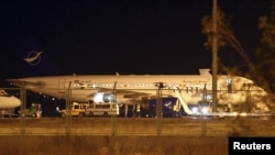 A Syrian passenger plane, which was forced to land, sits at Esenboga airport in Ankara October 10, 2012.