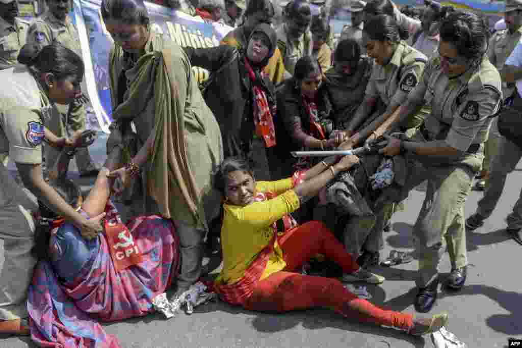 Police detain members of Communist Party of India (CPI) as they demand the resignation of Union Home Minister Amit Shah to take responsibility for the violence in Delhi, during a protest in Hyderabad, India.