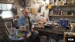 Clarke Bedford in his home studio, where he transforms junk into fantastical art.