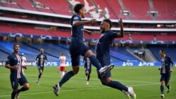 Paris Saint-Germain's Brazilian defender Marquinhos (L) celebrates with Paris Saint-Germain's Brazilian forward Neymar after scoring his team's first goal during the UEFA Champions League semi-final football match between Leipzig and Paris Saint-Germain a