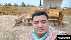 Sok Oudom, pictured at a construction site, is the owner of Rithysen radio station and a local citizen journalist in Kampong Chhnang province, Cambodia. (Courtesy of Facebook)