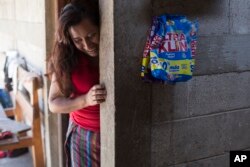 Paulina Gutierrez Alonzo, a 26-year-old Quiche indigenous woman, stands at her grandfather's house after giving an interview in Joyabaj, Guatemala, July 26, 2018. Gutierrez Alonzo was deported from United States in June and separated from her 7-year-old daughter, Antonia Yolanda Gomez Gutierrez, who is currently at an immigration center in Arizona, despite the Thursday deadline for reuniting children with their families who were caught entering the U.S. without authorization.