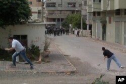 Des manifestants anti-gouvernementaux à Banias, en Syrie .