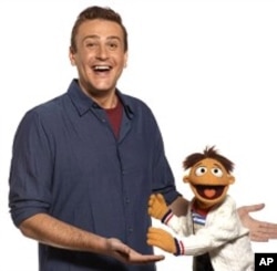 (L-R)Jason Segel and Walter in "The Muppets"