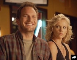 Left to right: Patrick Wilson plays Buddy Slade and Charlize Theron plays Mavis Gary in YOUNG ADULT, from Paramount Pictures and Mandate Pictures.