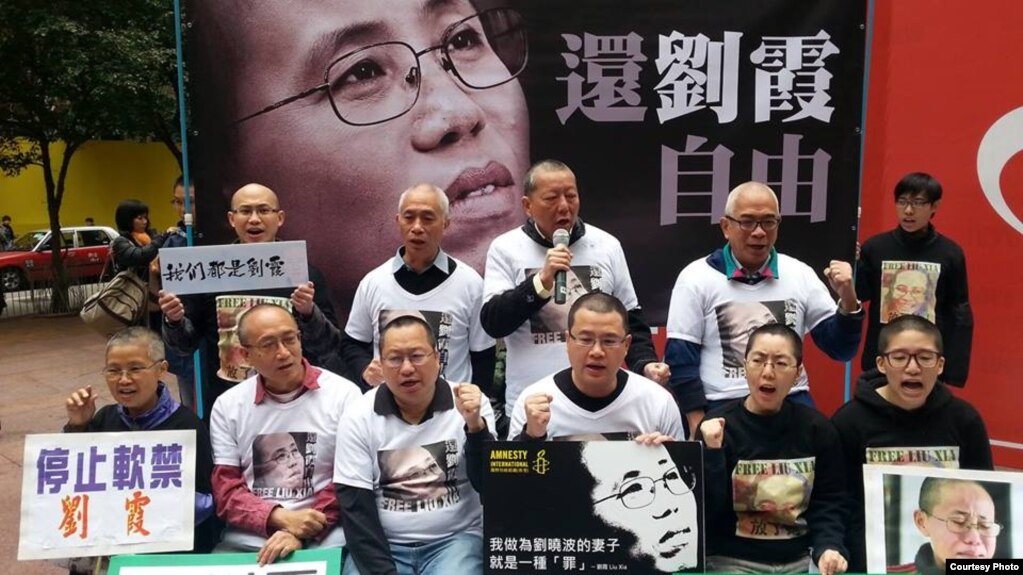 胡佳等维权人士剃头明志声援刘霞（推特图片）